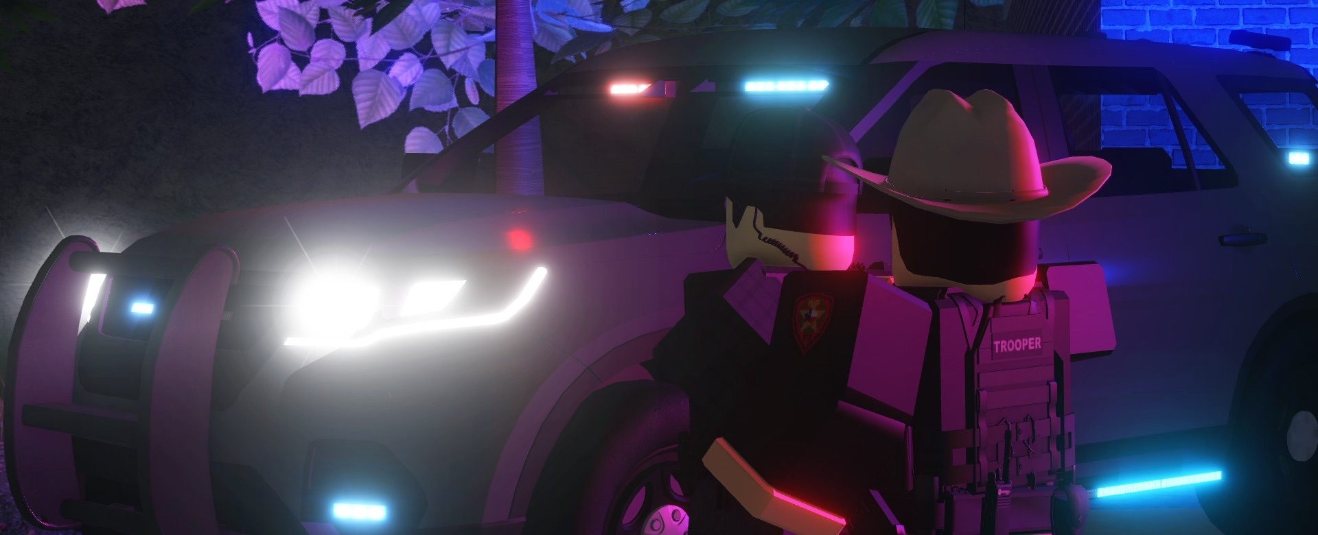 Trooper on patrol next to a DPS SUV